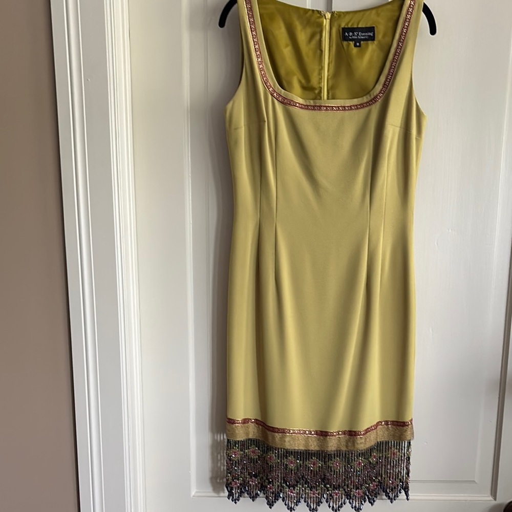 Green Sleeveless Dress with Beaded Hem
Size 8